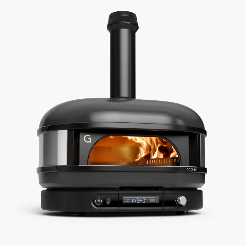 A Gozney Dome pizza oven in off-black on a stand
