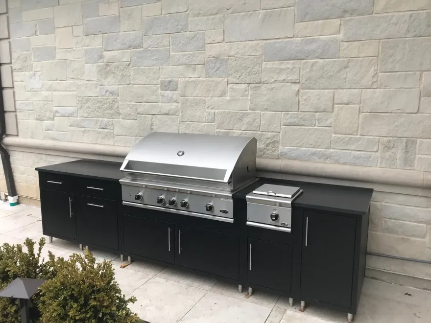 Aluminum outdoor kitchen island with countertop and side burner
