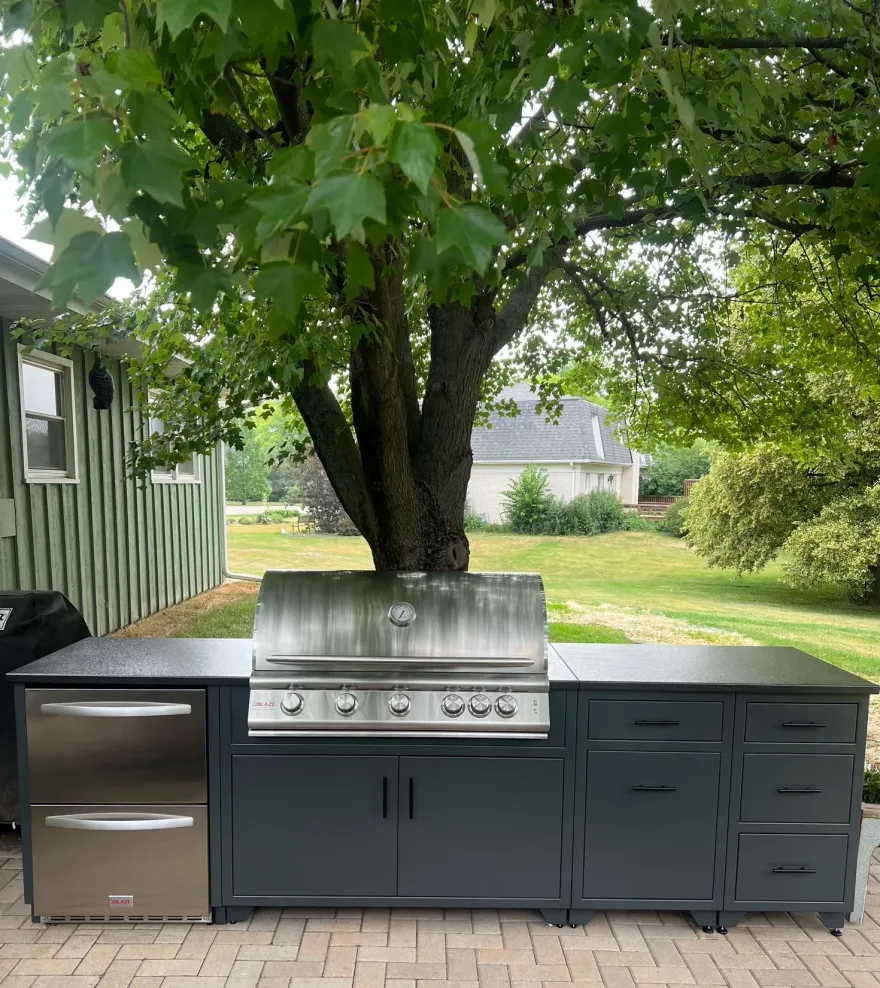 Aluminum outdoor kitchen island with built-in grill and outdoor-rated fridge