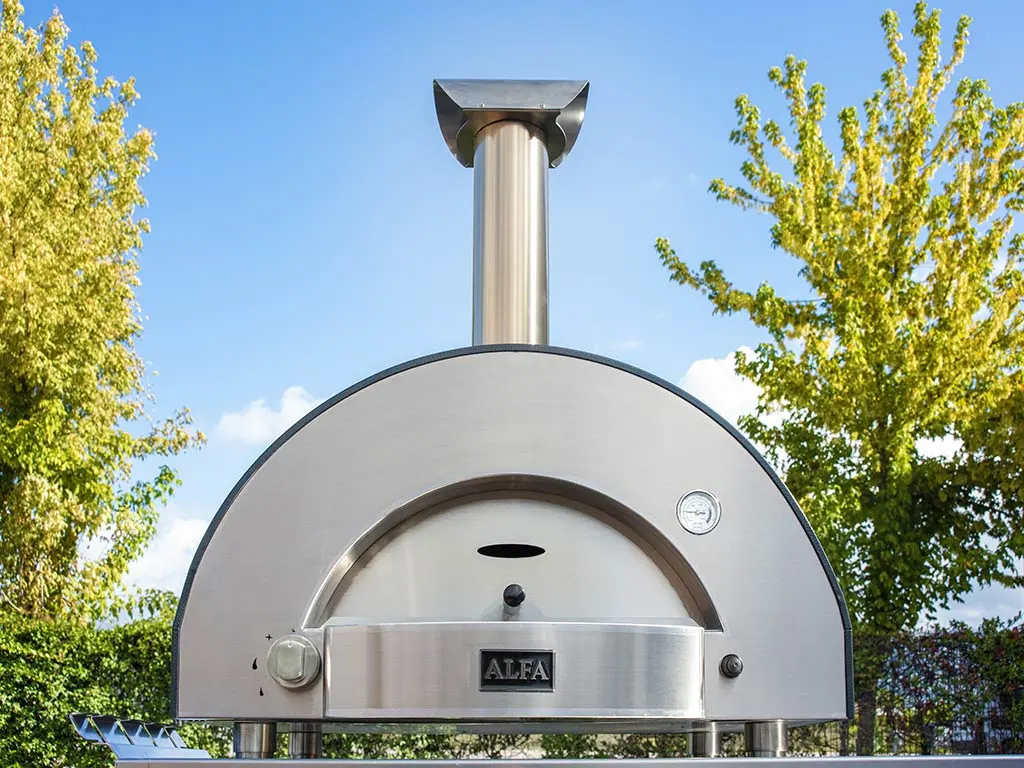 An Alfa Forni Classico 2 Pizze wood-fired oven on a stand outdoors